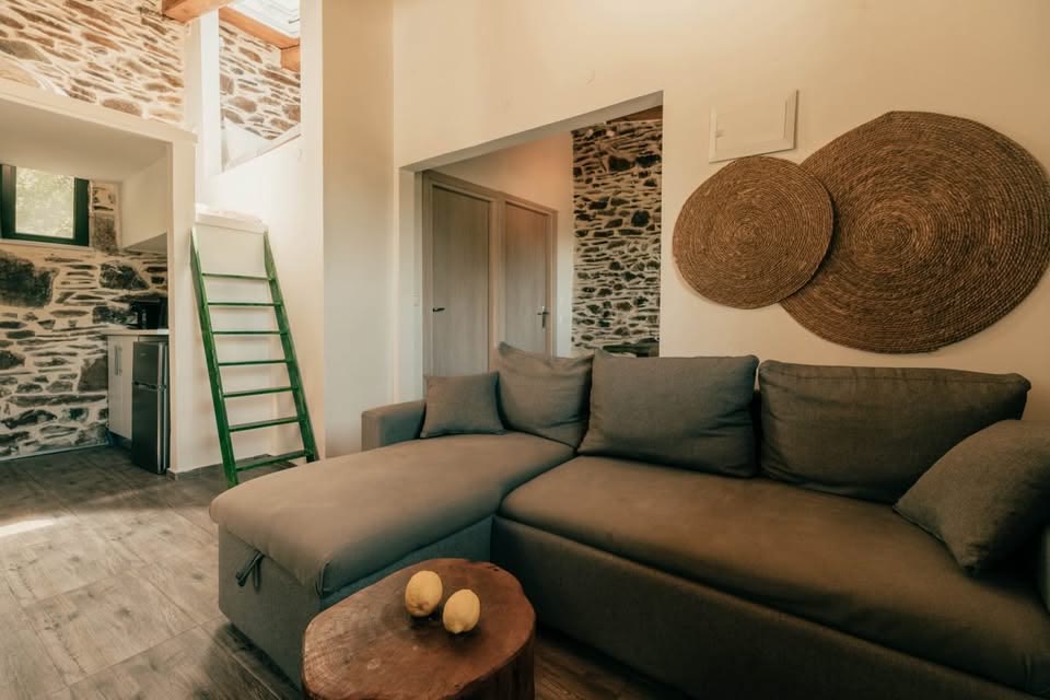 Two Bedroom Apartment — lounge with loft staircase